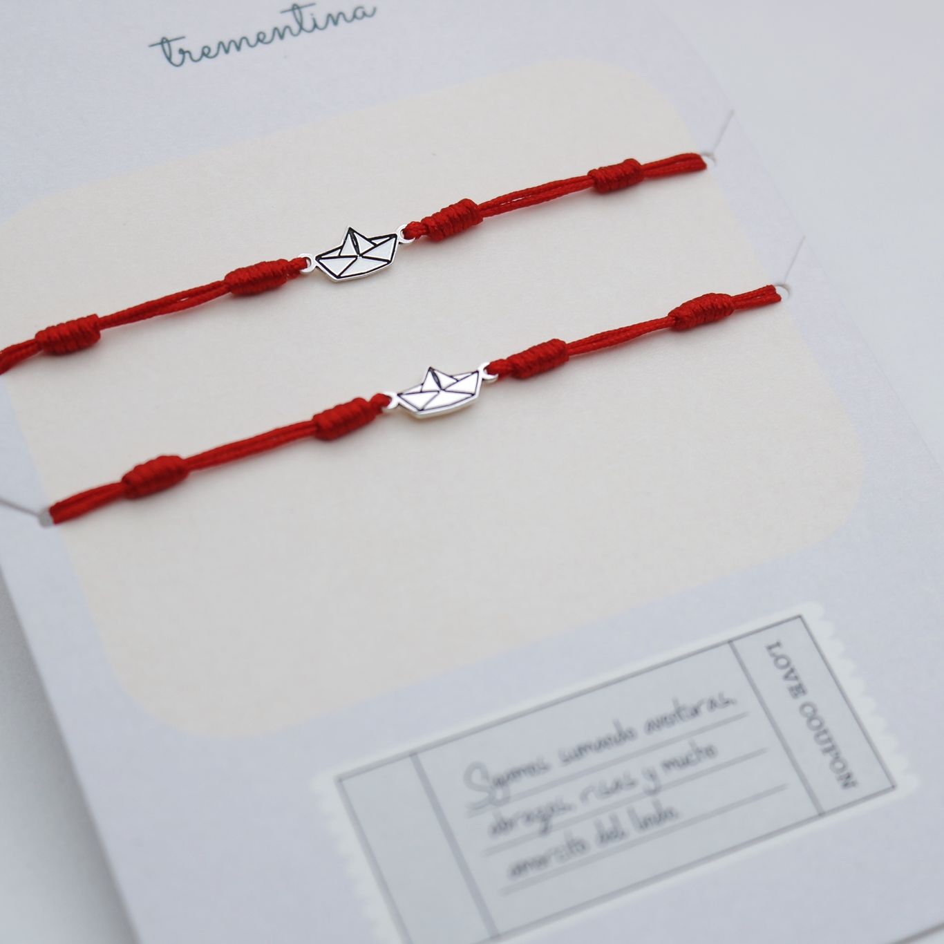 Set de Dos Pulseras Hilo Barquito de Papel Origami