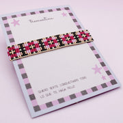 Pulsera Tejida Cuadros Fucsia y Negro